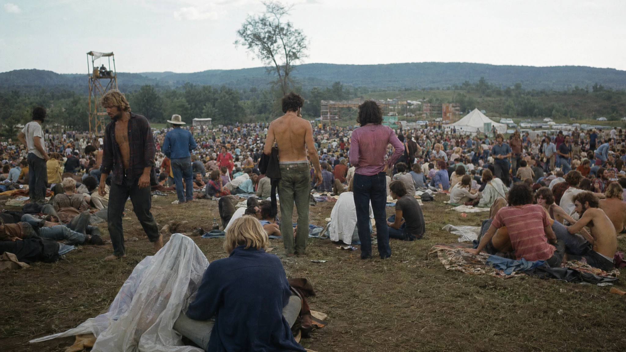 GPT Image 2 world knowledge — outdoor crowd in Bethel NY August 1969 inferred as Woodstock with period accuracy