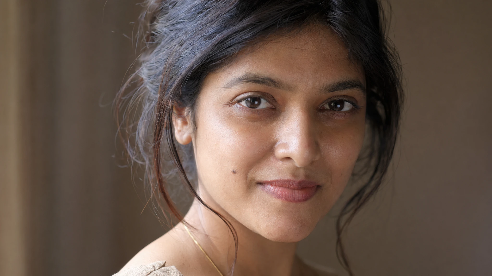 GPT Image 2 photorealistic portrait — soft window light, 85mm perspective, visible pore texture